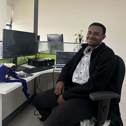 Caleb Kutkue working at a computer